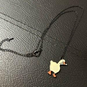 Untitled goose game necklace